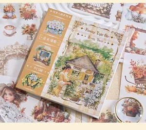Close-up of vintage scrapbook sticker book with floral girl illustrations