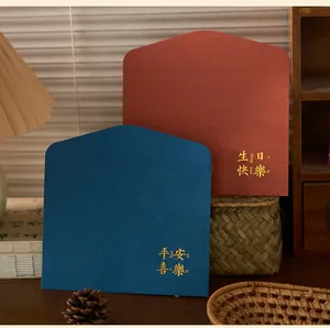 Detail of vintage envelopes with gold foil Chinese blessings for birthday and peace.
