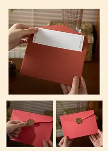 Detailed view of vintage red envelope set with gold foil letter paper and wax seal sticker