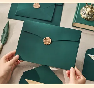 Close-up of dark green envelope with vintage For You gold wax seal.