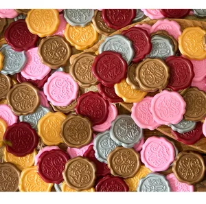 Close-up detail of multi-colored vintage wax seal stickers with For You engraving