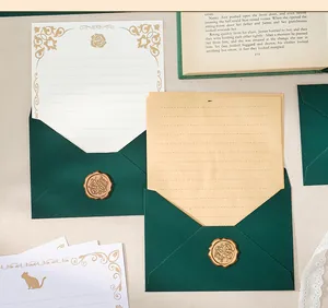 Detailed close-up of dark green envelopes and vintage letterhead set with wax seals