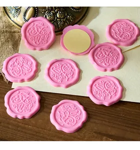 Close-up detail of pink self-adhesive vintage wax seal stickers with For You relief