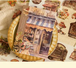 Close-up of vintage sticker book with retro girl and shop illustration