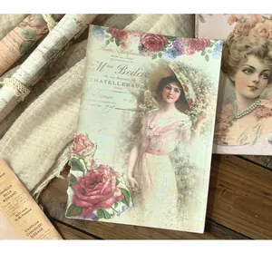 Detail of vintage scrapbooking paper featuring classical lady and rose illustration