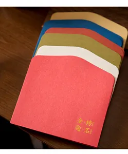 Macro detail of gold-stamped colorful envelopes with textured paper finish