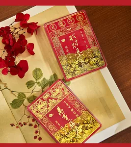 Macro view of Chinese style acrylic quicksand fridge magnets with gold foil details