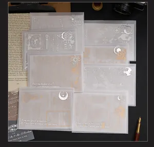 Detailed view of vellum paper material with intricate silver and gold foil stamping