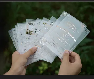 Detailed macro view of vintage vellum paper sheets with shimmering gold foil text