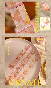 Detail von goldfoliertem Washi Tape mit Schmetterlings-Briefmarken für Vintage-Journaling