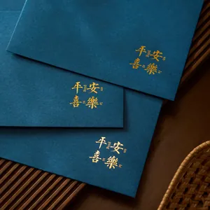 Elegant deep blue stationery envelope set with gold foil Peace and Joy blessing characters.