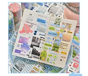 Lifestyle detail showing various colorful stickers and washi tapes on a journal page