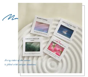 Close-up of four aesthetic PET slide charms featuring healing landscape quotes