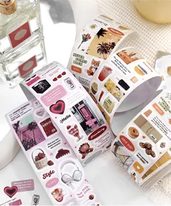 Detail view of decorative washi tape rolls with cute food and lifestyle stickers