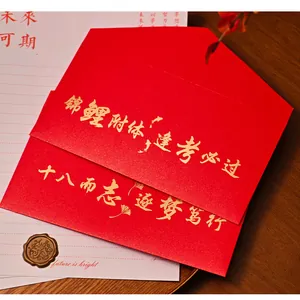 Close-up of red envelope set with gold calligraphy for 18th birthday graduation gift