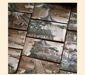 Detail view of traditional Chinese painting envelopes with intricate architectural patterns.
