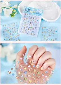 Detailed view of mini 3D embossed afternoon tea stickers applied on manicured nails