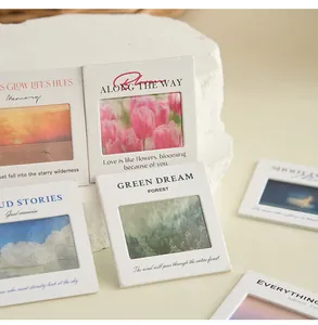 Detailed view of artistic PET slide-style keychains with nature landscapes and quotes