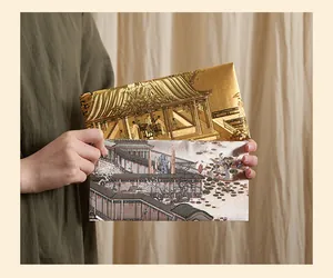 Detailed view of traditional Chinese style envelopes with landscape painting patterns.