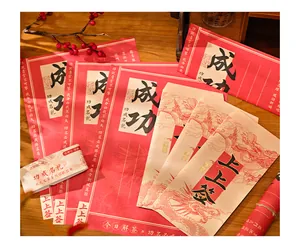 Close-up of Chinese style stationery set with dragon envelopes and red letterheads