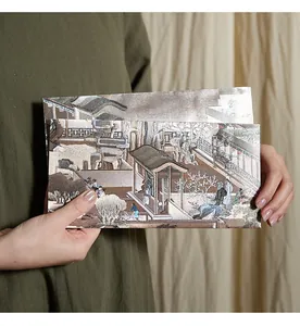 Close-up of Qingming Shanghe Tu style stationery envelopes featuring classical Chinese art