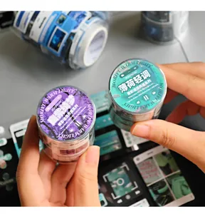 Close-up of decorative washi tape rolls with music player interface design