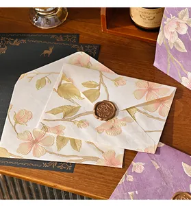 Detail showing embossed floral texture and wax seal on vintage envelope