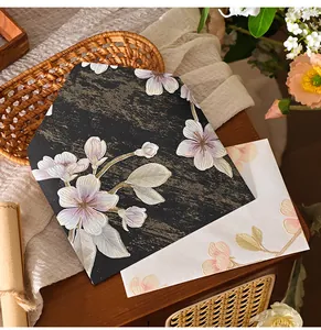 Close-up of vintage embossed floral envelopes with elegant gold textures