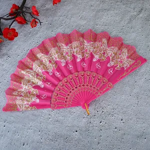 Abanico plegable chino vintage en rosa brillante con patrones de mariposas doradas
