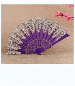 Close-up of a purple lace folding fan featuring elegant gold and white embroidery detail