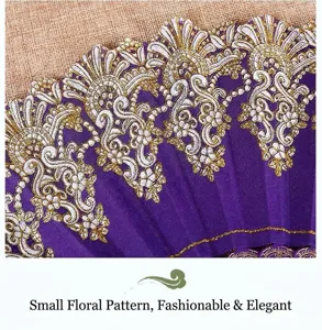Close-up of purple folding fan with ornate gold floral lace pattern and rich texture
