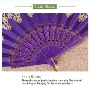 Macro detail of elegant purple plastic fan ribs featuring gold floral pattern and metal ring