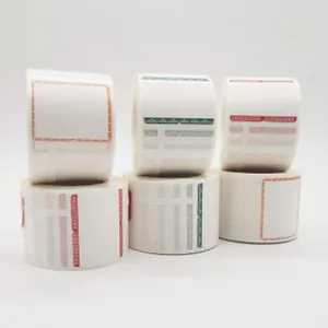 Close-up view of white adhesive roll labels featuring various colorful decorative borders