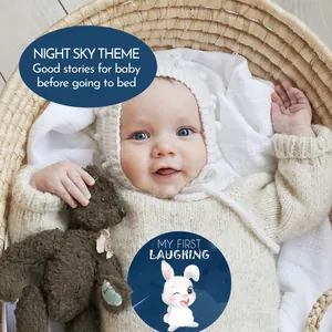 Close-up detail of baby monthly milestone sticker with rabbit and night sky theme