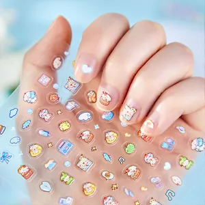 Cute embossed nail art stickers with cartoon food patterns shown on fingers.
