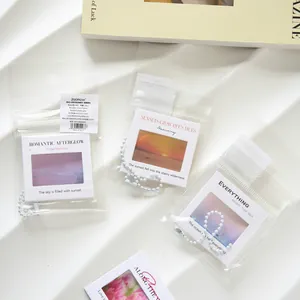 Minimalist aesthetic PET reversal film keychains featuring sunset photography and healing text