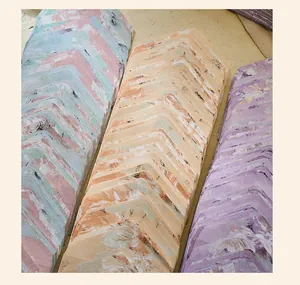 Detailed macro shot of vintage floral embossed envelopes in assorted pastel colors