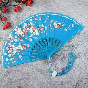 Elegant blue folding fan with white plum blossoms and decorative tassel for dancing