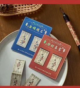 Close-up of Chinese traditional banknote style magnetic bookmarks in red and blue packaging