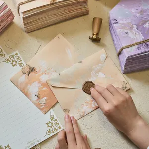 Vintage floral letter paper and envelope set with embossed texture for letter writing.