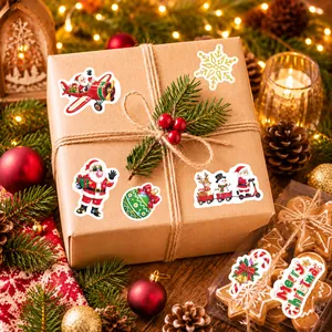 Festive holographic waterproof Christmas stickers decorating a brown kraft paper gift box