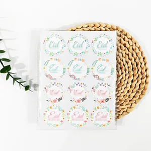 Detail showing floral Eid Mubarak circular stickers for festive gift sealing and favors