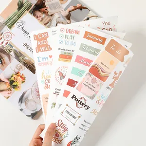 Close-up of inspirational vision board stickers for DIY scrapbooking and journaling