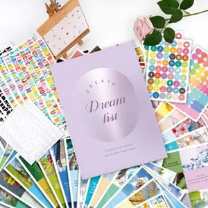 Creative DIY vision board kit including purple Dream List book and various cards