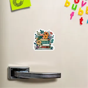 Pegatina de libro floral en superficie blanca con letras magnéticas de colores vivos