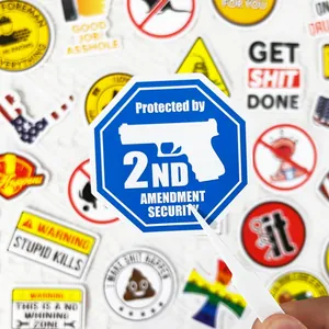 Detail view of a blue 2nd Amendment security sticker among various vinyl decals