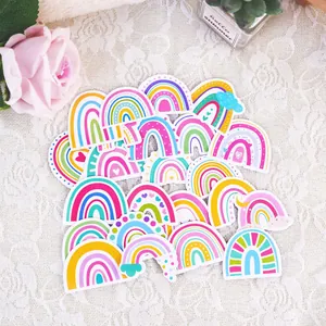 Close-up of vibrant rainbow-themed cartoon stickers for kids birthday party favors