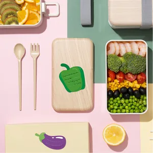 Detailed view of cute green bell pepper and purple eggplant shaped food-themed stickers.