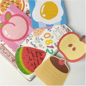 Close-up of cute food-shaped sticky notes used in a colorful creative journal layout
