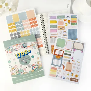 Vista detallada del libro de pegatinas BOHO con varias hojas estéticas
